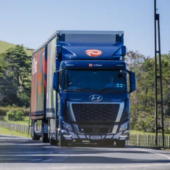 Hyundai XCIENT Fuel Cell truck driving on a forest road