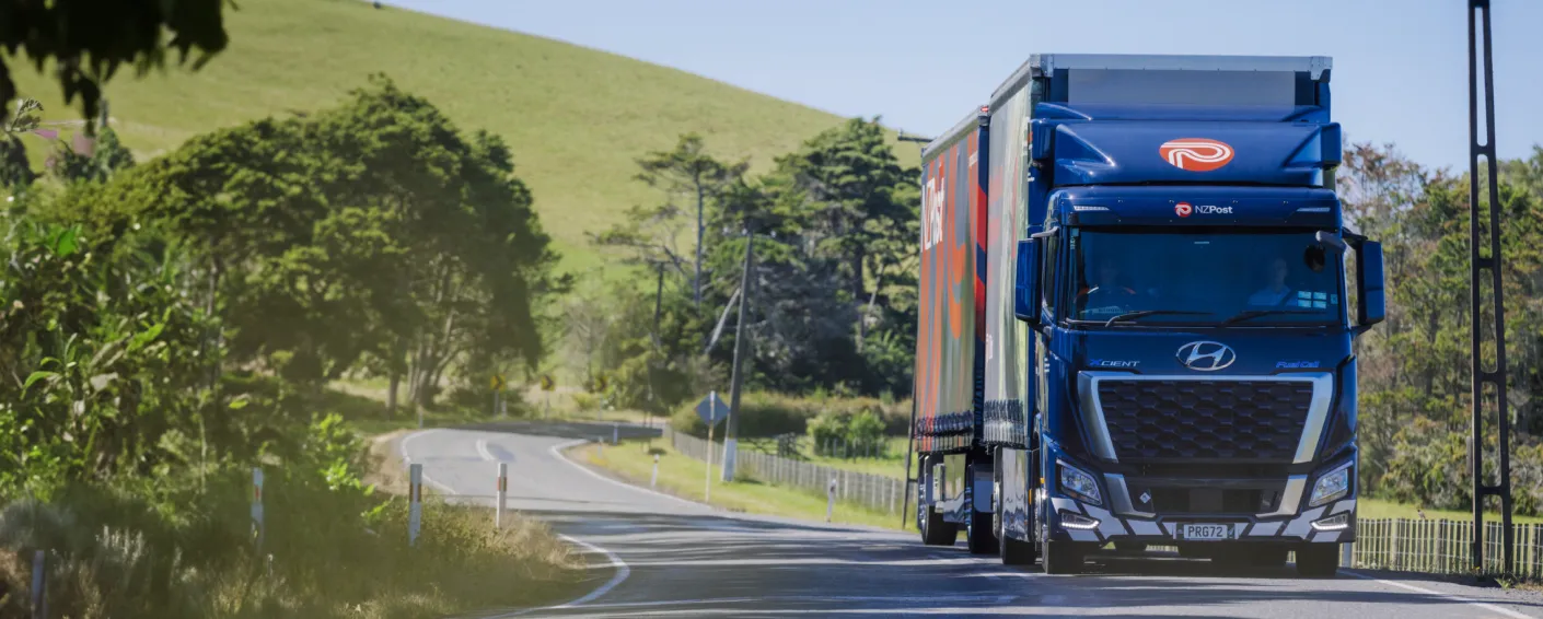 Hyundai XCIENT Fuel Cell truck driving on a forest road