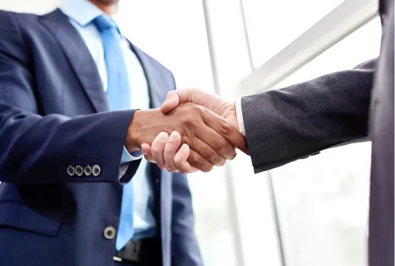 Two business men shaking hands