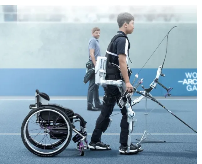 Disabled person participating in an archery competition with the help of an exoskeleton robot