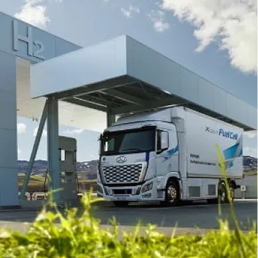 Hyundai XCIENT Fuel Cell Truck in front of the charging station